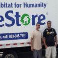 ReStore donation pickup truck and two crew members