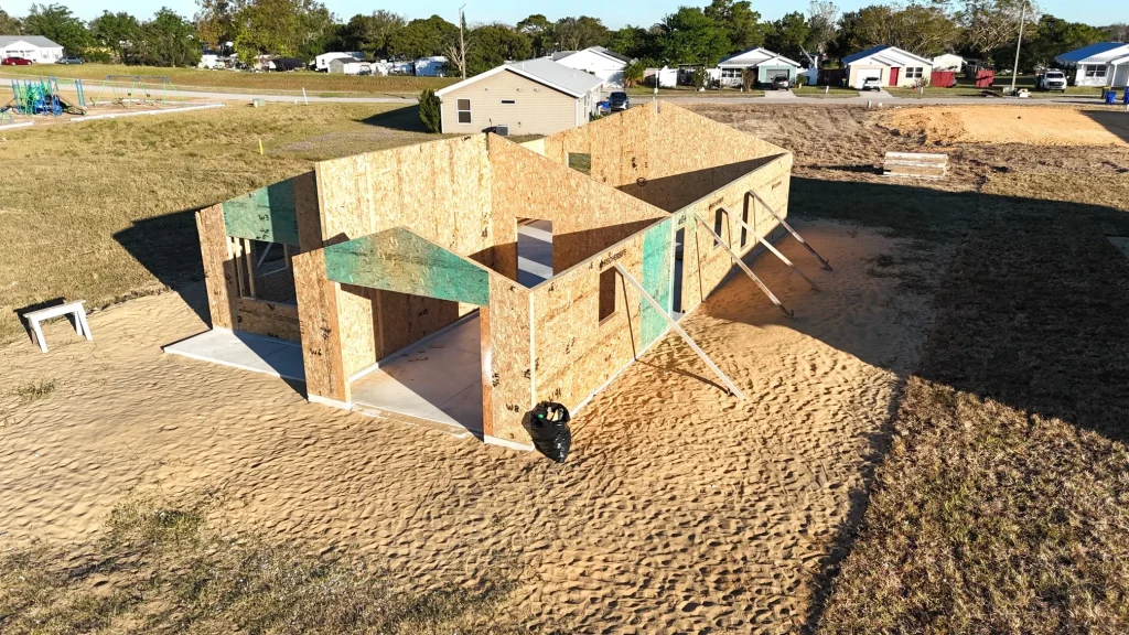 Aerial view of a completed Habitat home with surrounding houses