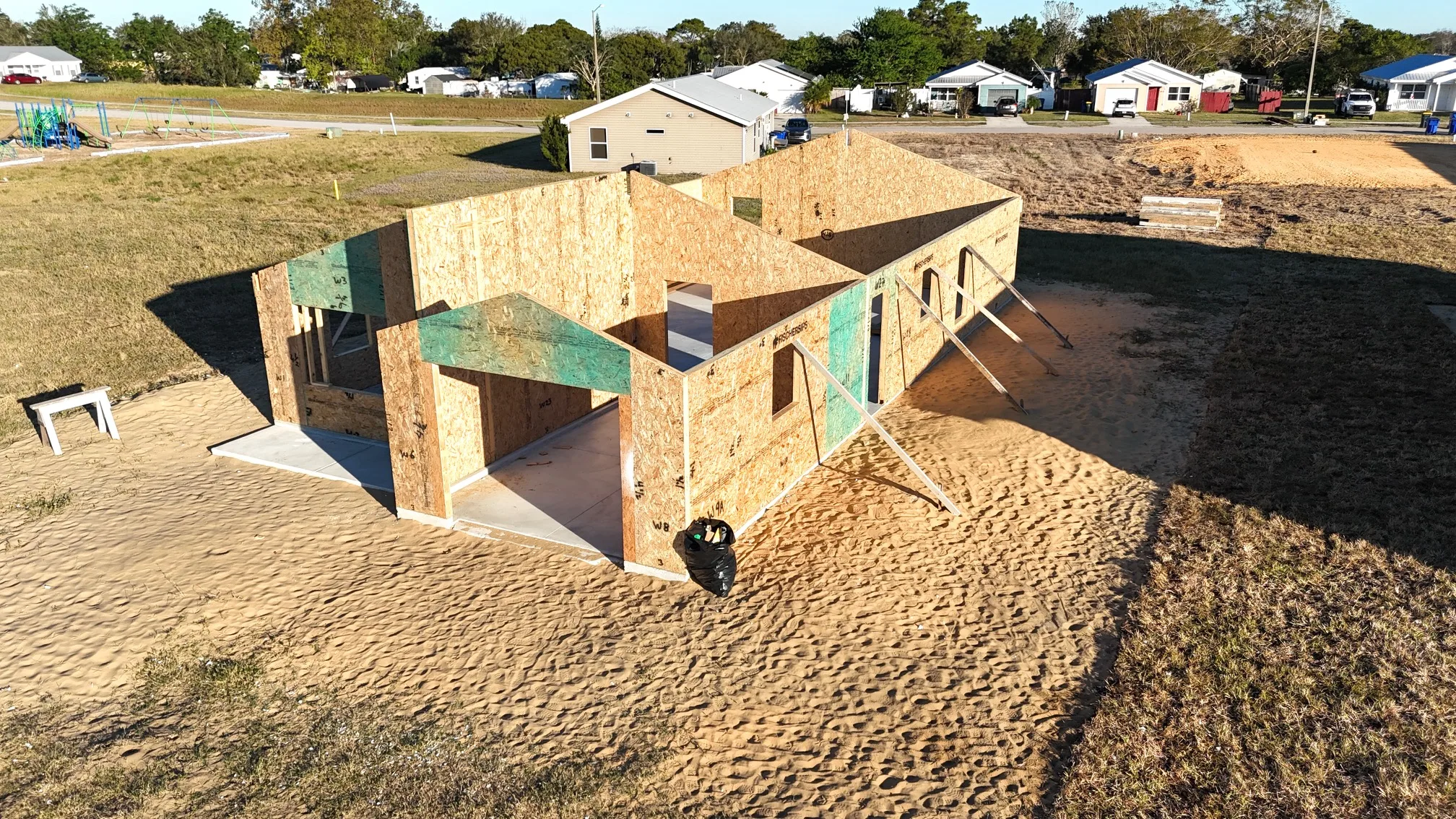 Aerial view of a completed Habitat home with surrounding houses