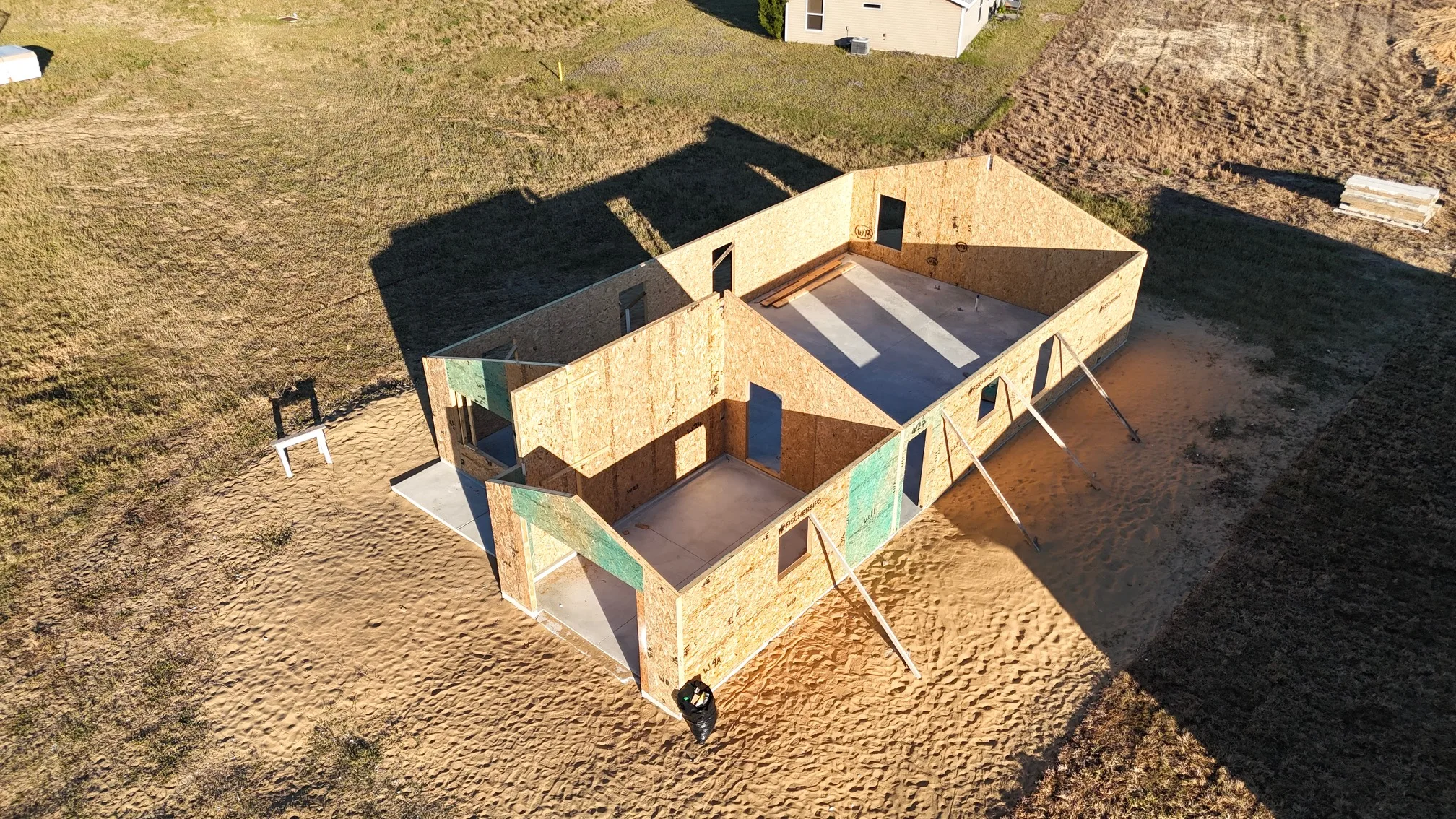 Aerial view of a Habitat home framing project on a build lot