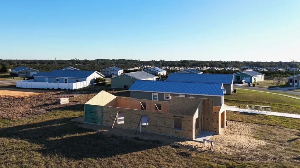 Aerial view of a Habitat home framing project on a build lot