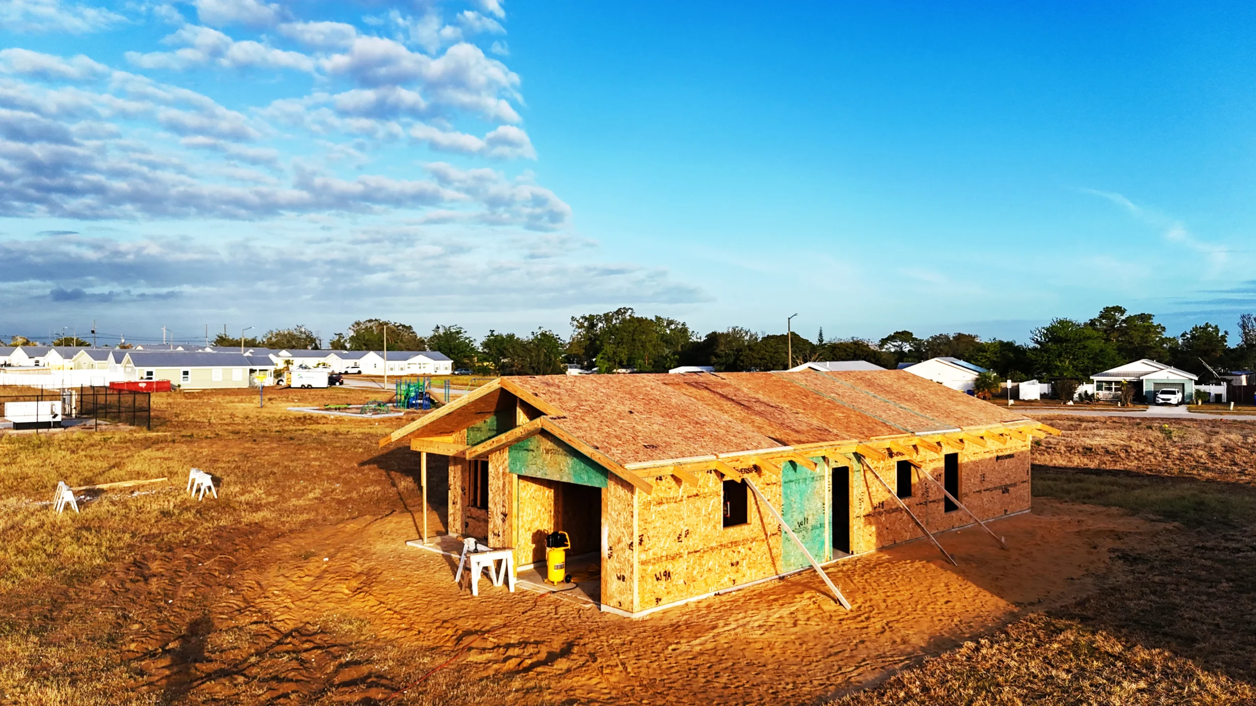 Aerial view of a Habitat home framing project on a build lot