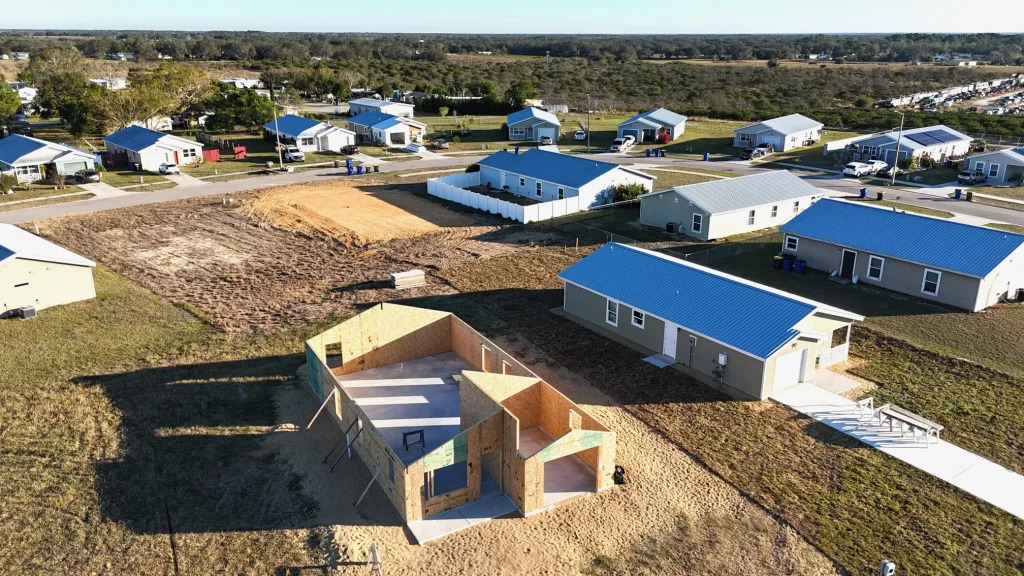 Aerial view of a completed Habitat home and nearby neighborhood