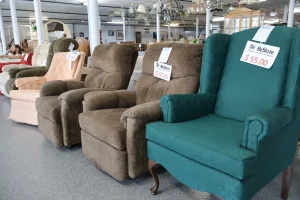 Brown and teal recliners and a wingback chair priced at Habitat ReStore Sebring